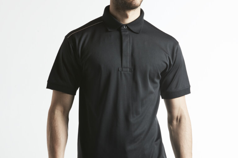 Photo of man wearing Portwest KX3 Polo shirt in black