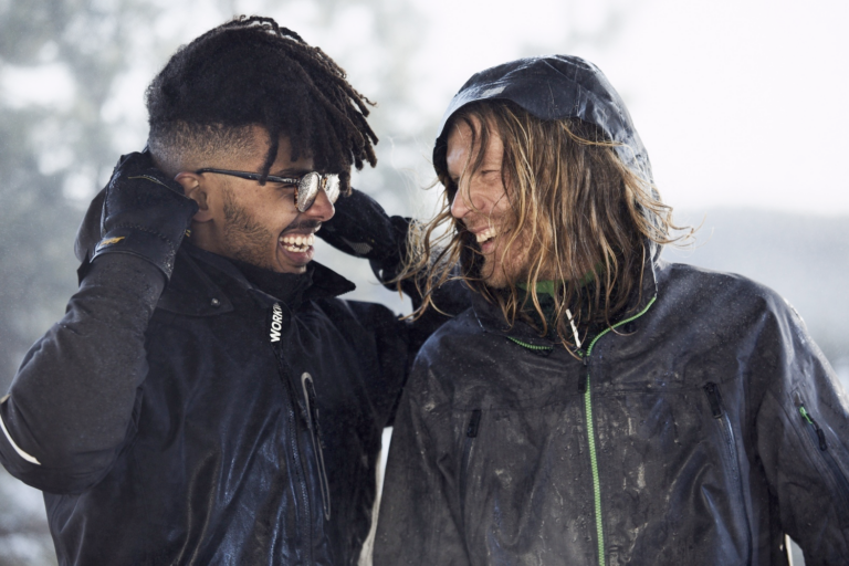 Photo of two men outdoors wearing waterproof jackets